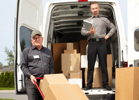Local Ealing removal team loading furniture for transport
