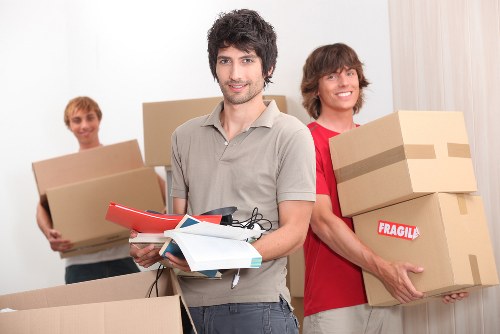 Business moving crew loading office items during a relocation in West London