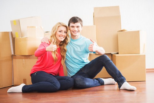 Removal team handling packed household items during transport