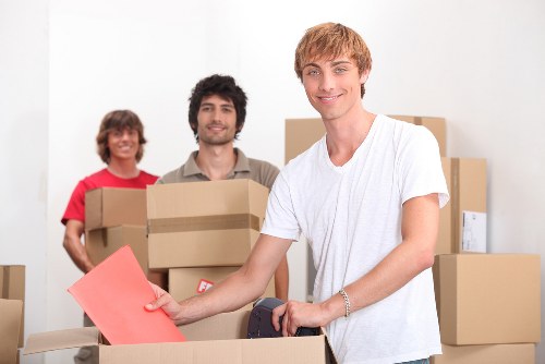 Prepared moving boxes and labelled household items ready for removal in Ealing